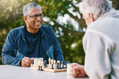 photo of older men playing chess